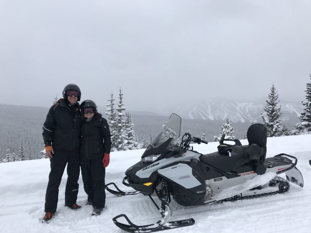 Sandy and Ira Bornstein snowmobiling at Winter Park Resort