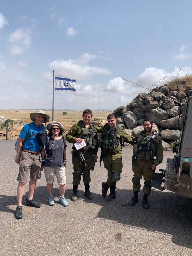 Sandy and Ira Bornstein stopping to chat with IDF tank soldiers stationed on the Syrian Border; Image Taken by Eric Tomer